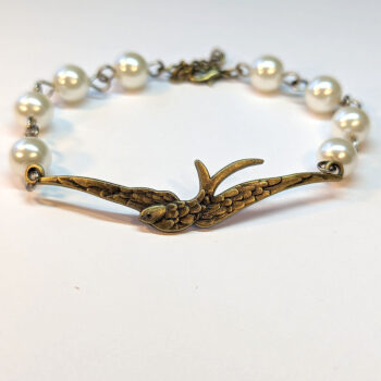 Antique Bronze Large Soaring Bird White Beads Bracelet