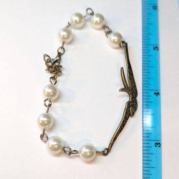 Antique Bronze Large Soaring Bird White Beads Bracelet - Image 2